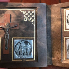 Load image into Gallery viewer, Portable Stations Of The Cross Shrine, Book Form, 14 Pewter Medallions Set On Leather, Gold Blocked, Beautiful Condition. Silver Corpus Christi with Gilded Halo